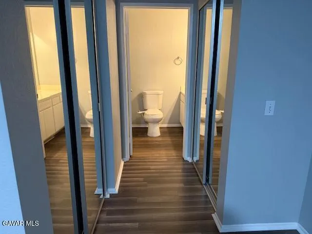 a view of a bathroom from the hallway