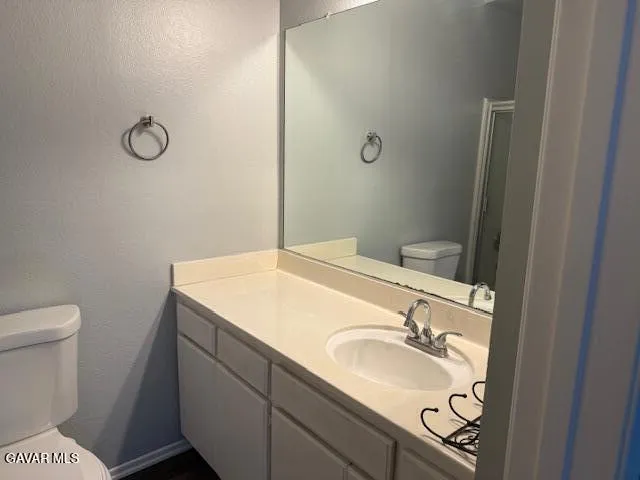a bathroom with a sink and a toilet