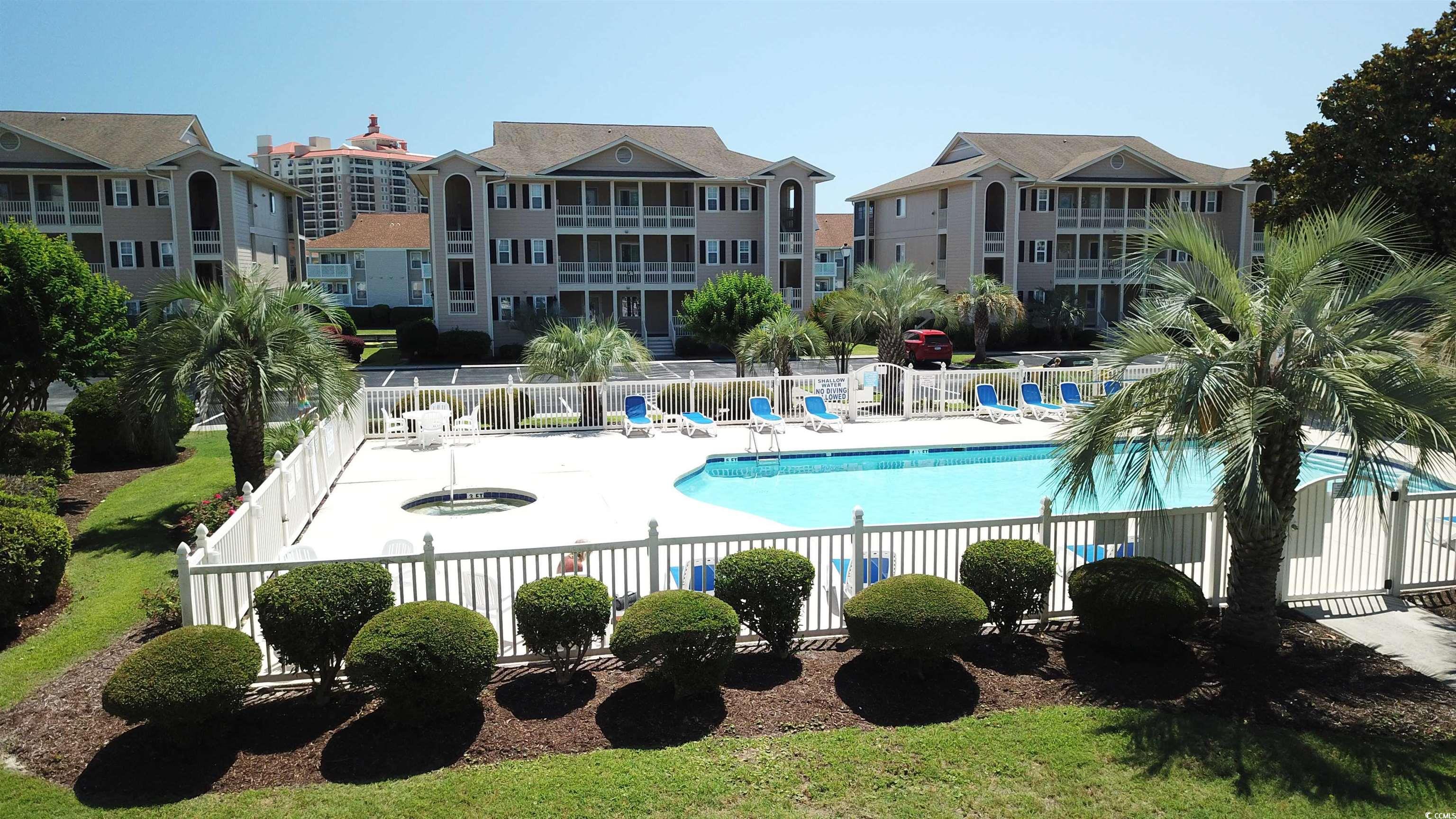 1900 Duffy Street, Unit L5 North Myrtle Beach, SC 29582 - Photo 14 of 18 Community pool with a patio