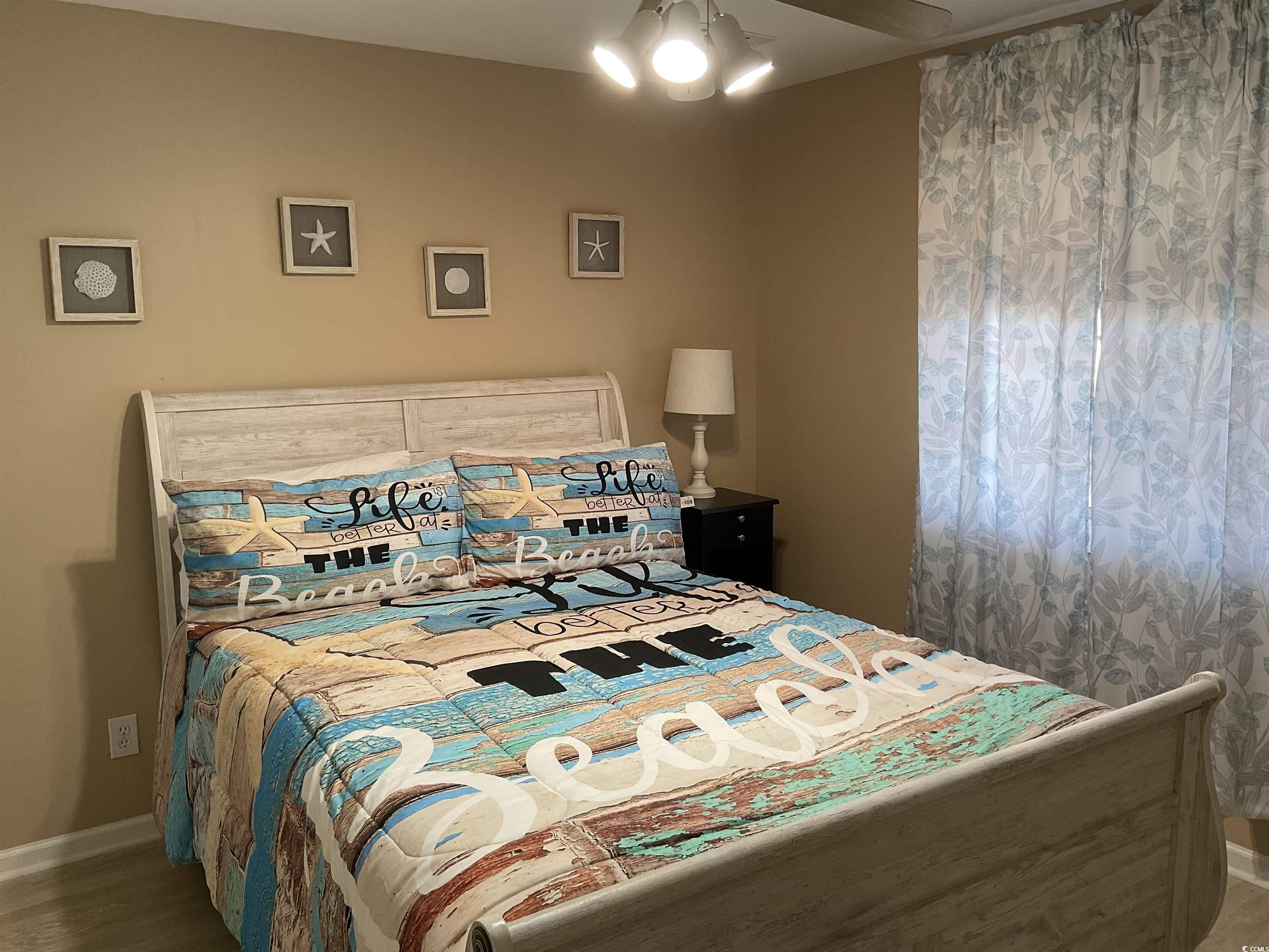 1900 Duffy Street, Unit L5 North Myrtle Beach, SC 29582 - Photo 3 of 18 Bedroom with baseboards and wood finished floors