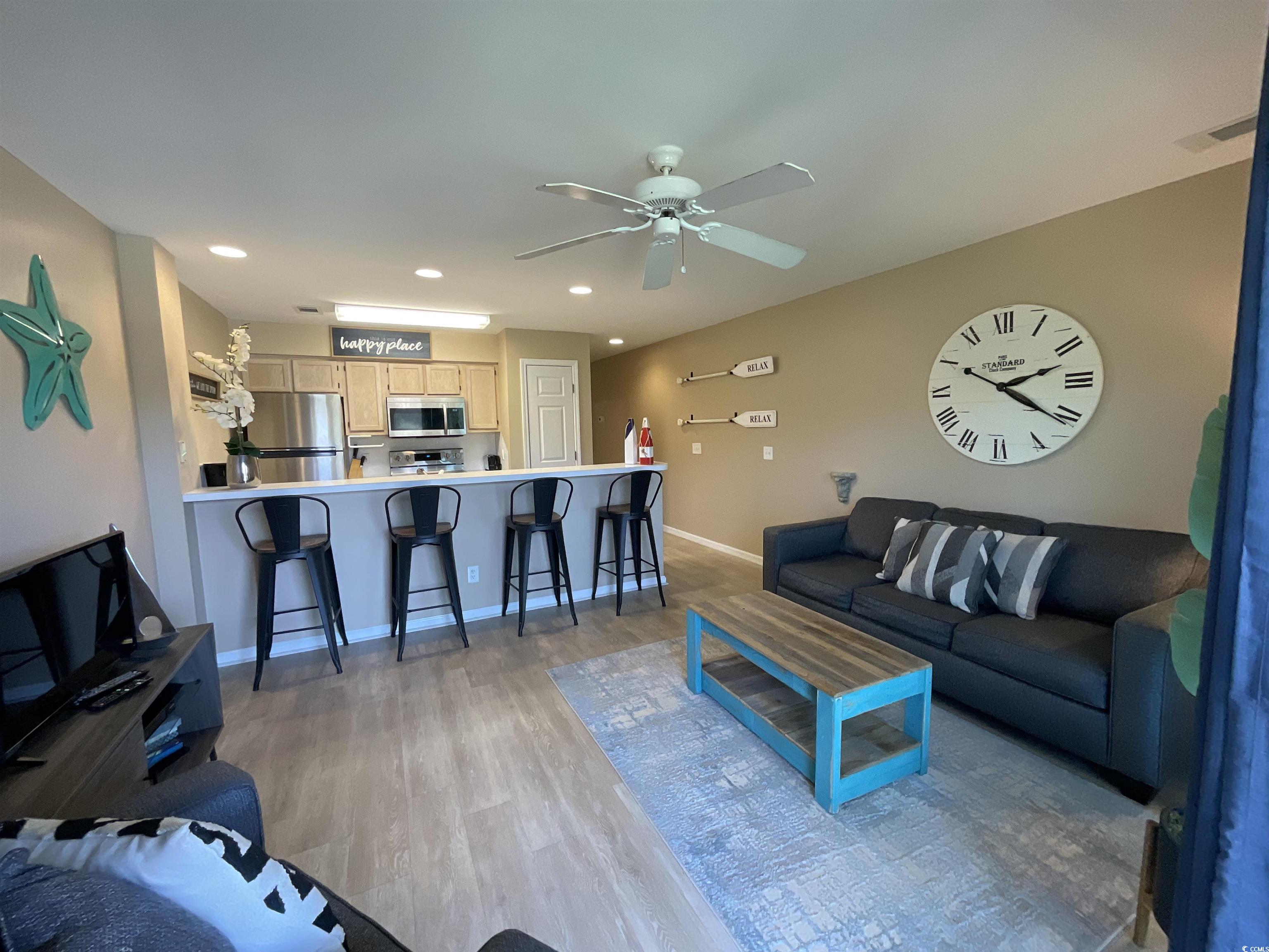 1900 Duffy Street, Unit L5 North Myrtle Beach, SC 29582 - Photo 8 of 18 Living area with light wood-style floors, a ceiling fan, baseboards, and recessed lighting