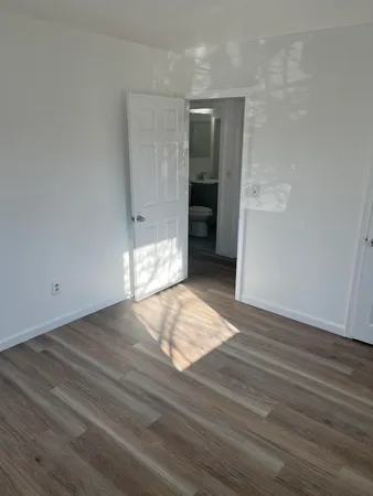 a white toilet sitting next to a bath tub