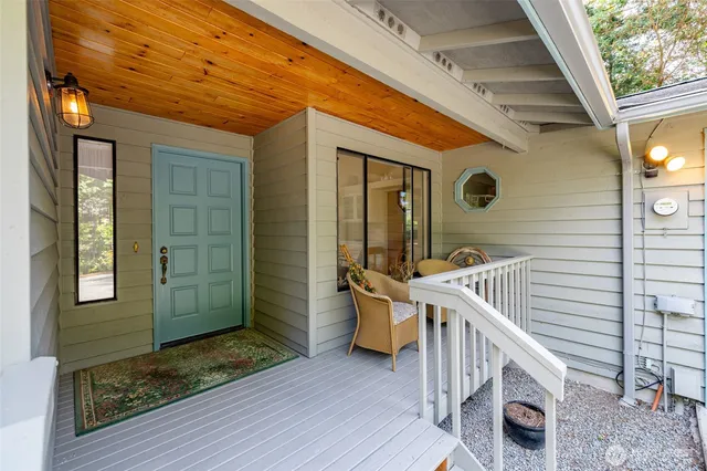 a view of balcony with wooden floor and fence
