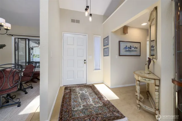 a kitchen with stainless steel appliances granite countertop a sink and cabinets