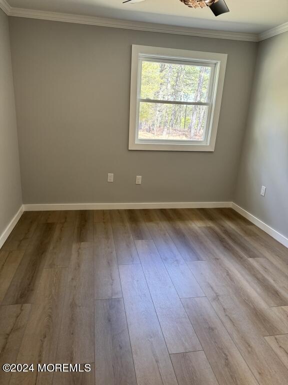 57 A Sunset Road Whiting, NJ 08759 - Photo 16 of 29 an empty room with wooden floor and windows