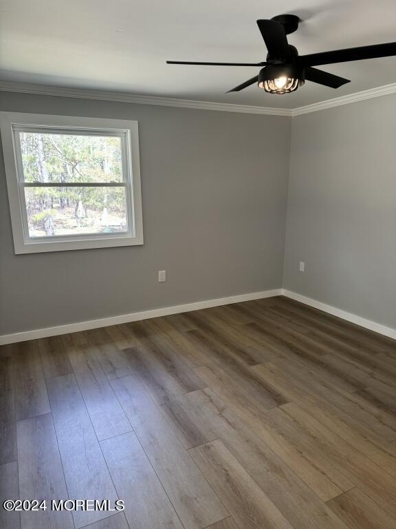 57 A Sunset Road Whiting, NJ 08759 - Photo 19 of 29 a view of an empty room with wooden floor and a window