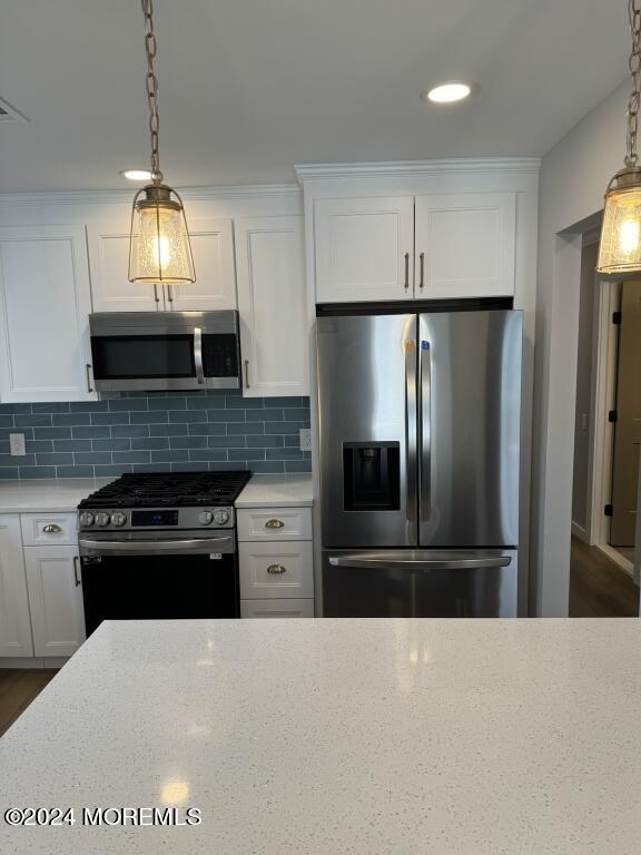 57 A Sunset Road Whiting, NJ 08759 - Photo 3 of 29 a kitchen with granite countertop a refrigerator and a stove top oven