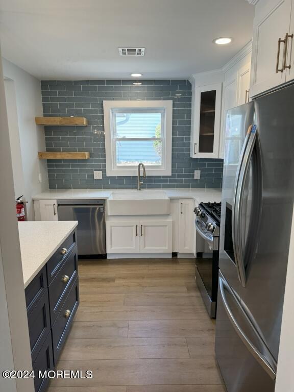 57 A Sunset Road Whiting, NJ 08759 - Photo 5 of 29 a kitchen with stainless steel appliances granite countertop a sink stove refrigerator and cabinets