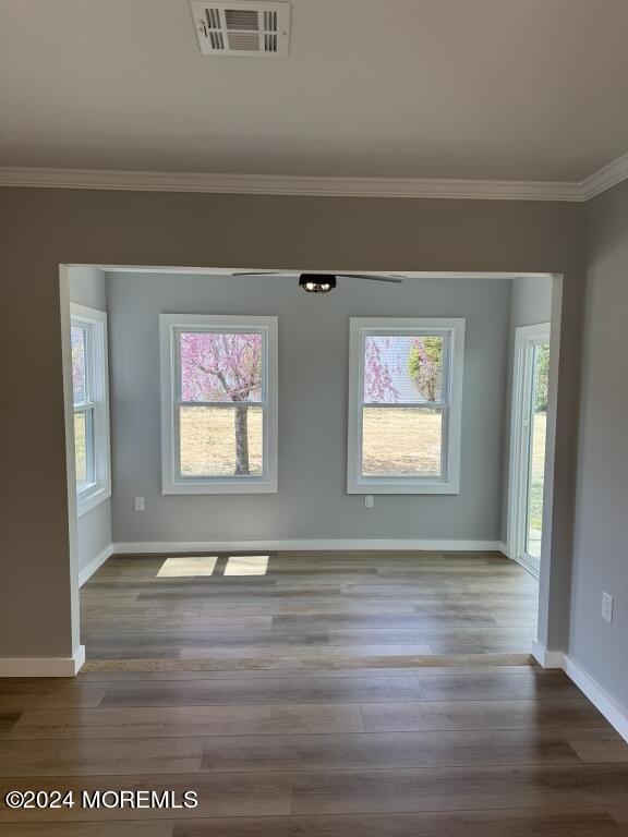 57 A Sunset Road Whiting, NJ 08759 - Photo 10 of 29 a view of an empty room with wooden floor and a window