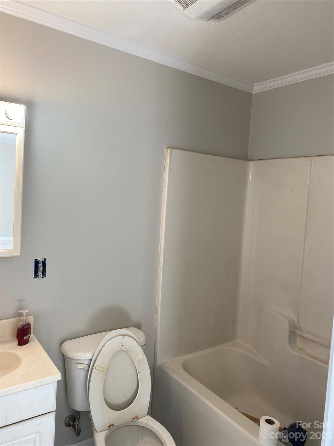 71 Hunter Bridge Road Stony Point, NC 28678 - Photo 19 of 26 a white toilet sitting next to a bath tub