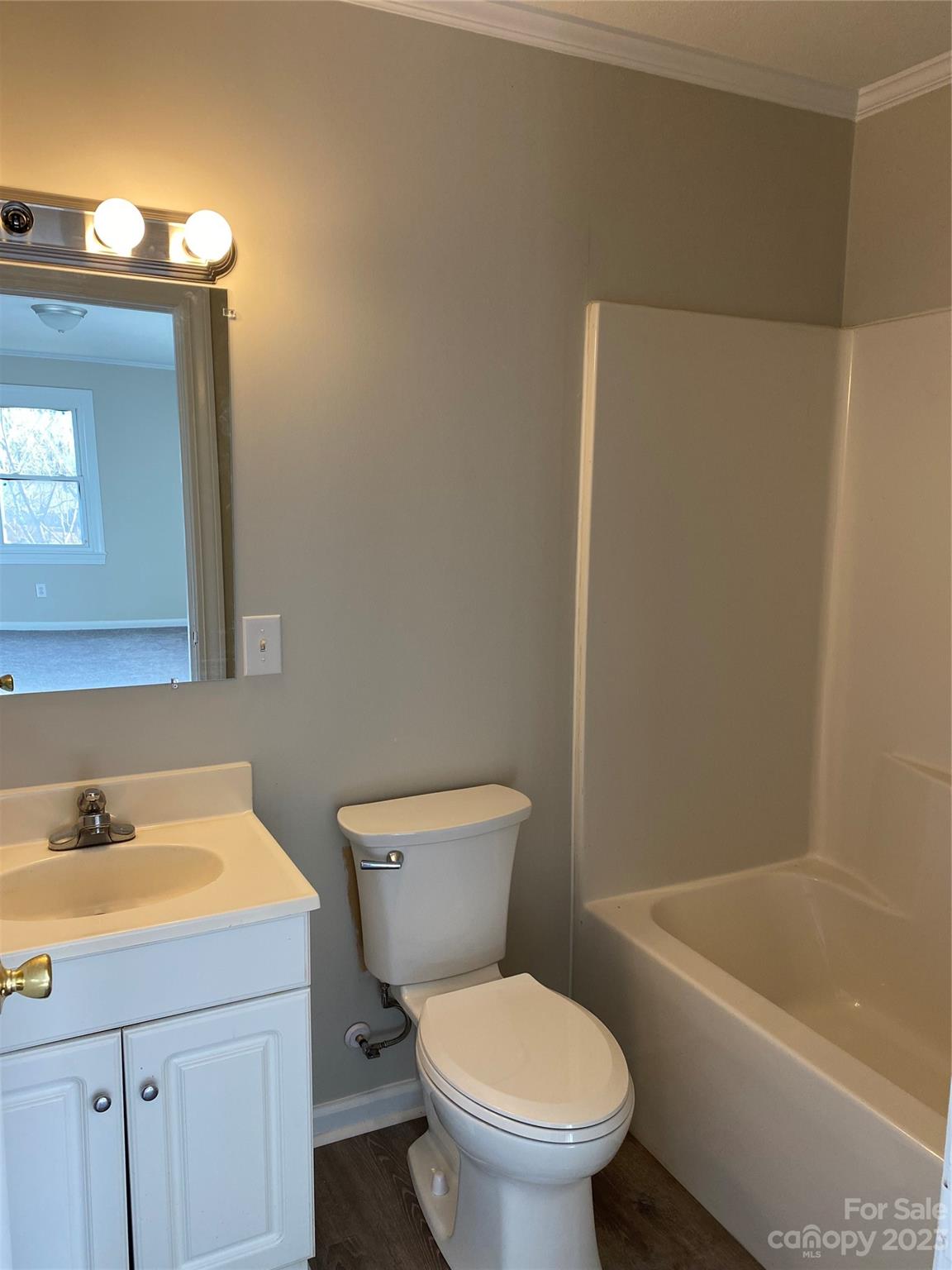 71 Hunter Bridge Road Stony Point, NC 28678 - Photo 20 of 26 a white toilet sitting next to a bath tub