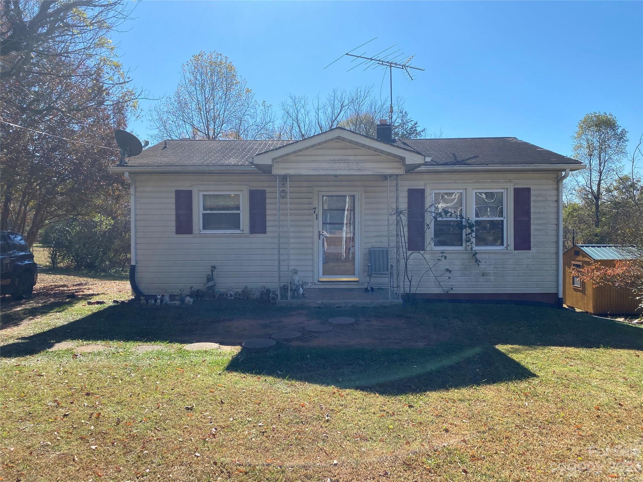 71 Hunter Bridge Road Stony Point, NC 28678 - Photo 3 of 26 a front view of a house with a yard