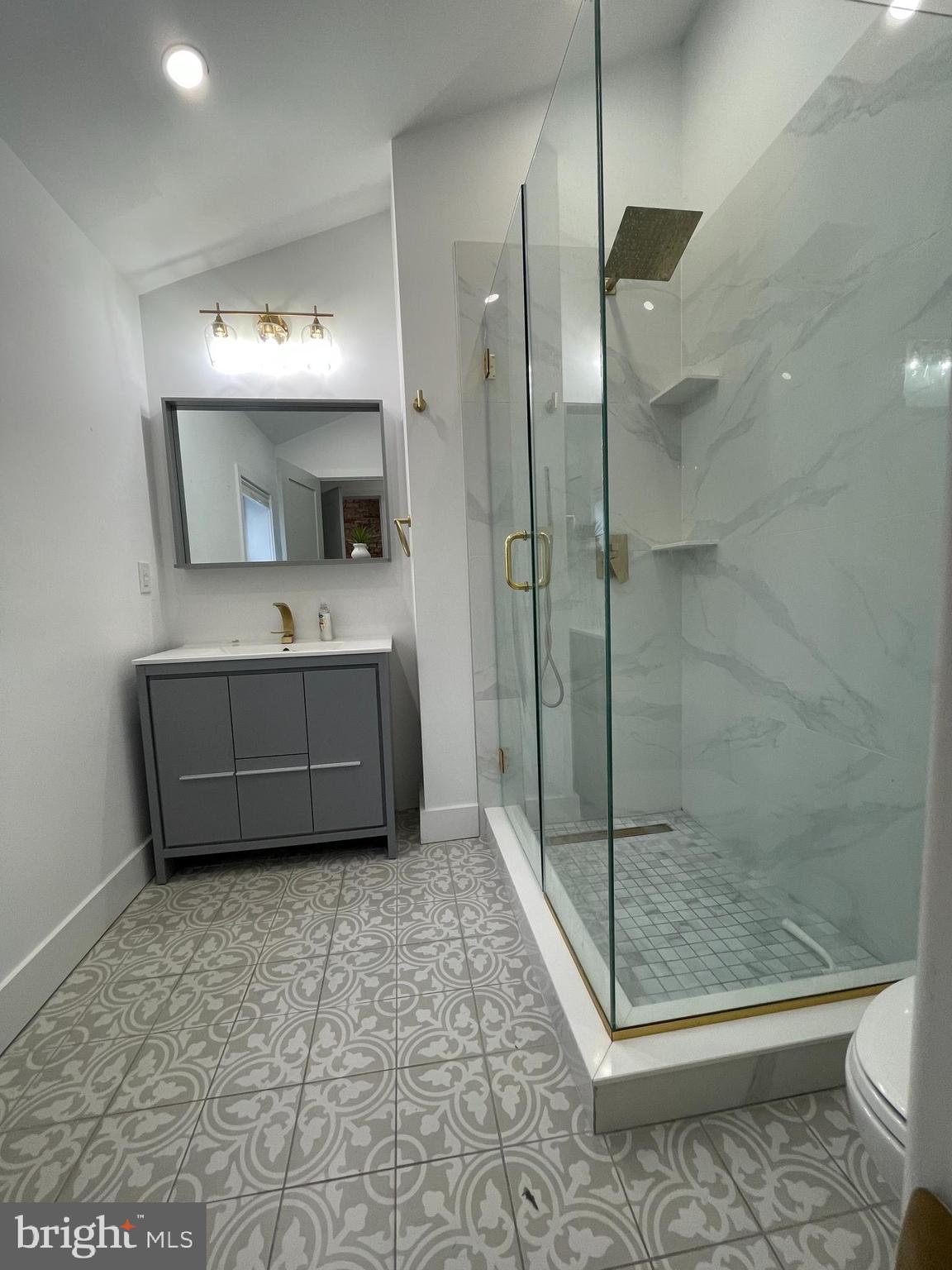 1205 South 4th Street, Unit 2 Philadelphia, PA 19147 - Photo 5 of 12 a bathroom with a sink a toilet and shower