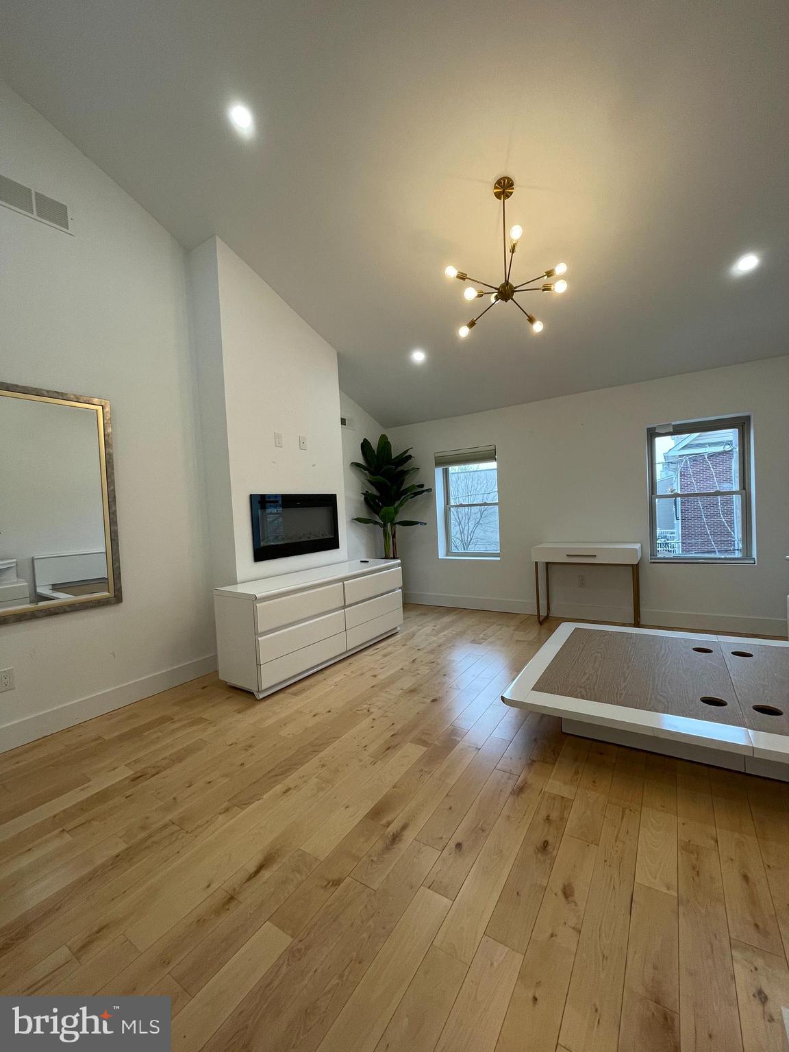 1205 South 4th Street, Unit 2 Philadelphia, PA 19147 - Photo 8 of 12 a view of a living room a room with wooden floor and ceiling fan