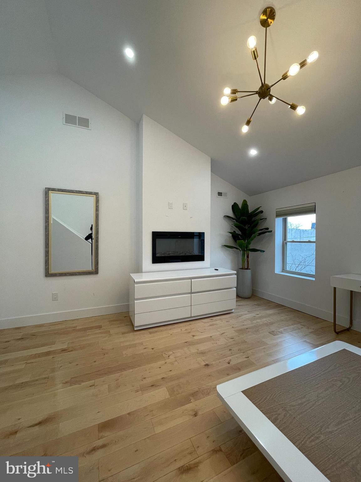 1205 South 4th Street, Unit 2 Philadelphia, PA 19147 - Photo 9 of 12 a living room with furniture and a flat screen tv