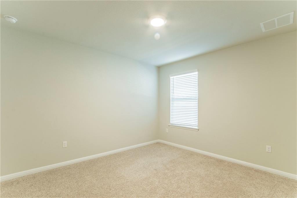 172 Arrowhead Vine Street Leander, TX 78641 - Photo 15 of 21 an empty room with a window