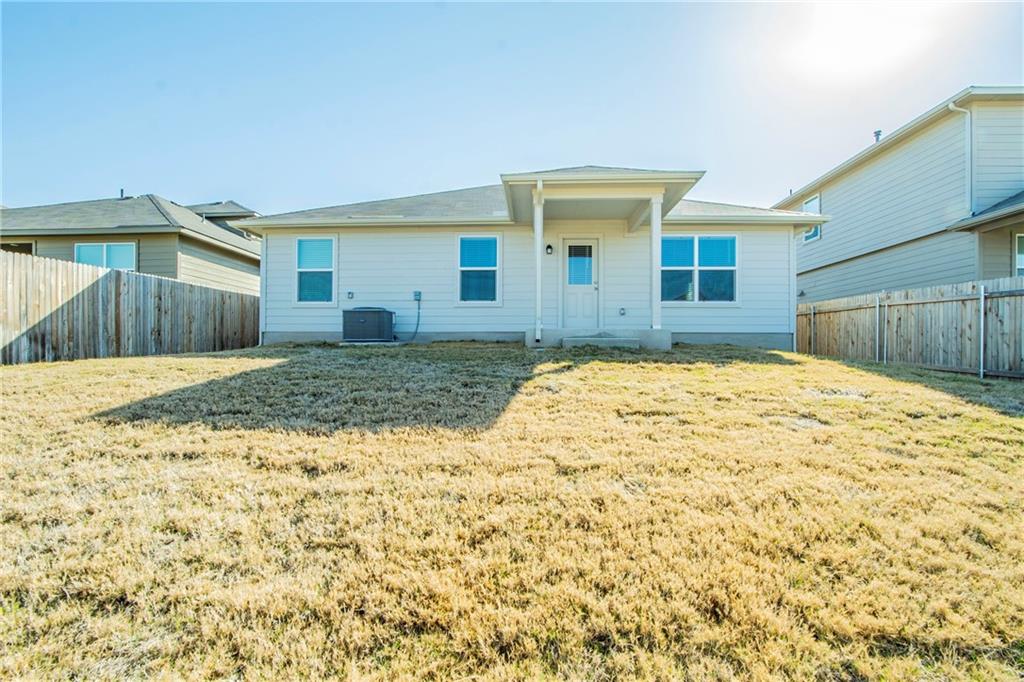 172 Arrowhead Vine Street Leander, TX 78641 - Photo 20 of 21 a house view with a backyard space