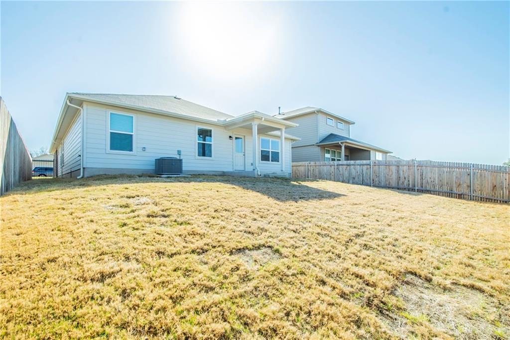 172 Arrowhead Vine Street Leander, TX 78641 - Photo 21 of 21 a view of a house with a yard and covered with snow in the background