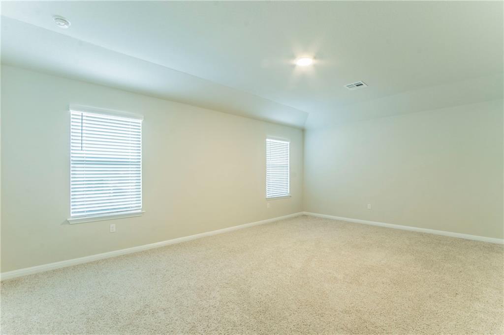 172 Arrowhead Vine Street Leander, TX 78641 - Photo 9 of 21 an empty room with a window