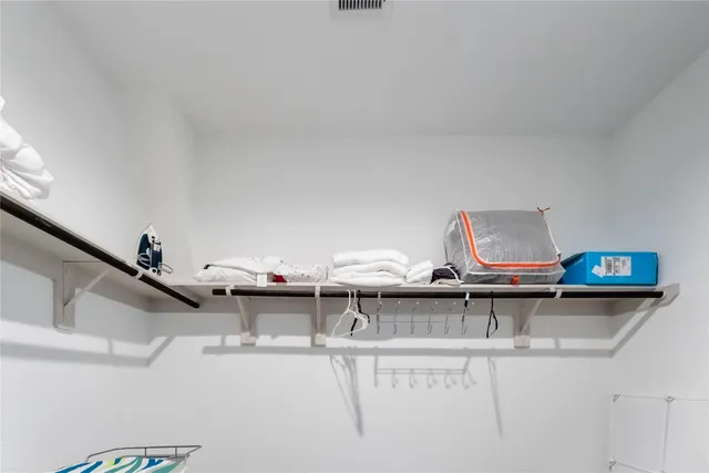 a view of living room with furniture and wooden floor
