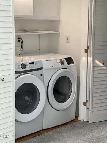 a utility room with dryer and washer
