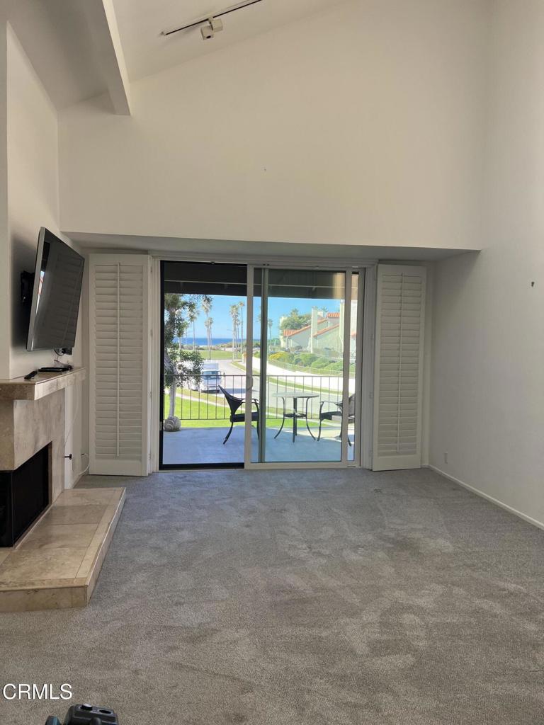 4510 Antigua Way Oxnard, CA 93035 - Photo 5 of 16 a view of an empty room with a window and a flat screen tv