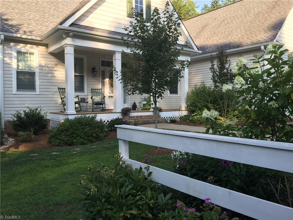 371 Foulks Road Madison, NC 27025 - Photo 2 of 30 Lush landscape in the spring.