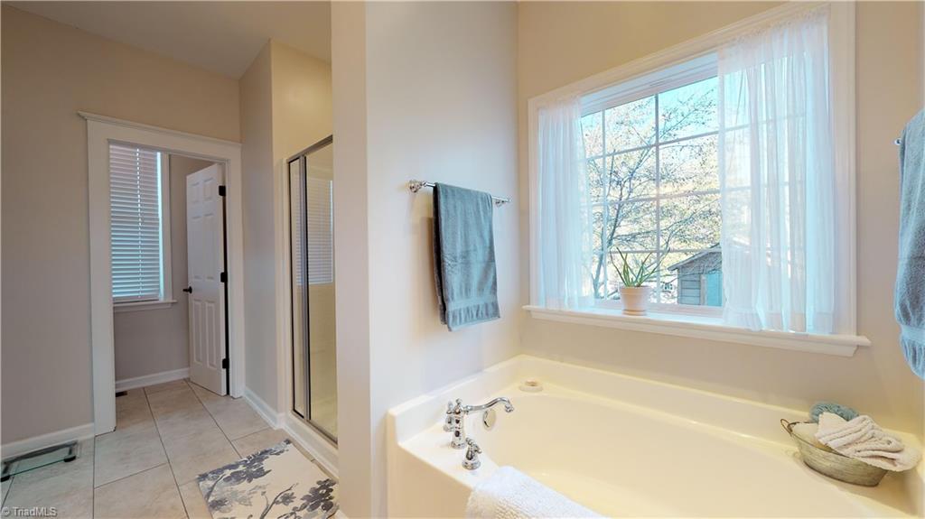 371 Foulks Road Madison, NC 27025 - Photo 22 of 30 Master bad with garden tub, separate shower and toilet.