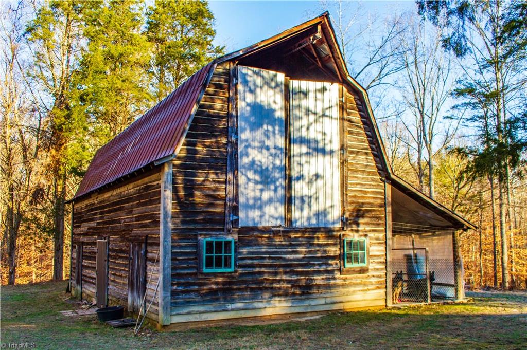 371 Foulks Road Madison, NC 27025 - Photo 6 of 30 Barn for storage and attached kennel space.