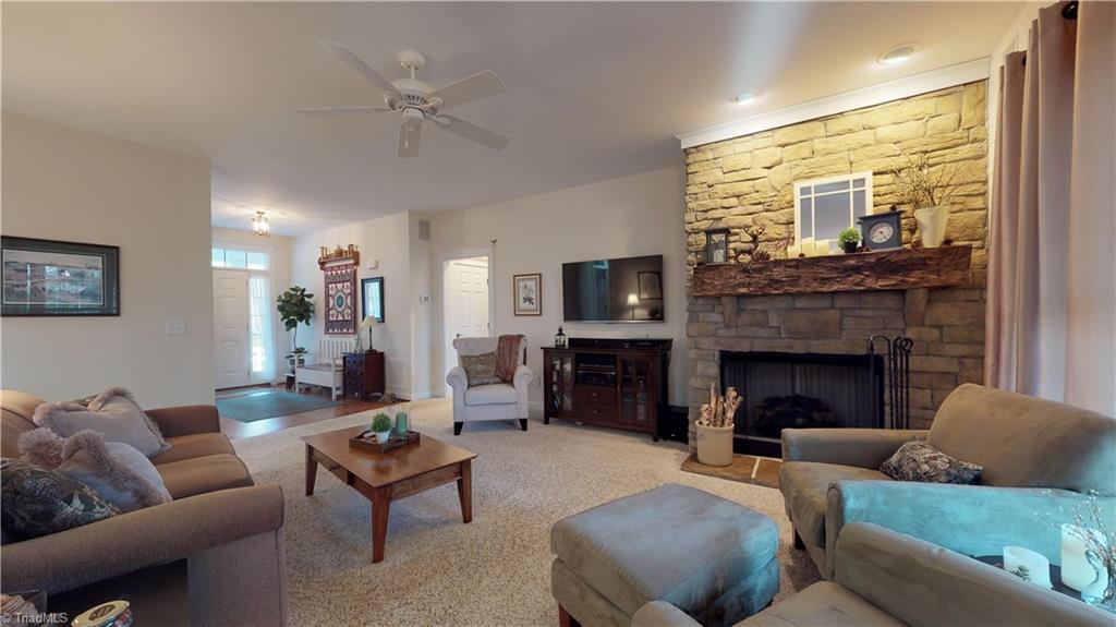 371 Foulks Road Madison, NC 27025 - Photo 10 of 30 Entry leads into family room with stacked stone fireplace, gas logs and custom mantel.