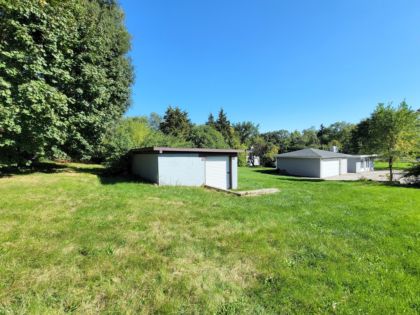 28W450 Roosevelt Road Winfield, IL 60190 - Photo 20 of 28 a front view of a house with a yard and trees