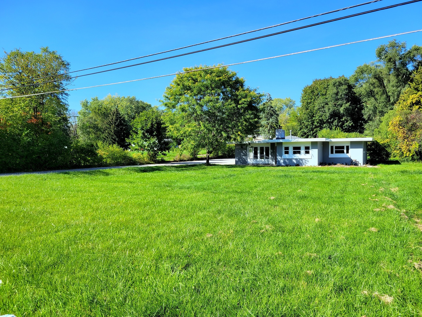 28W450 Roosevelt Road Winfield, IL 60190 - Photo 27 of 28 a view of a house with a big yard
