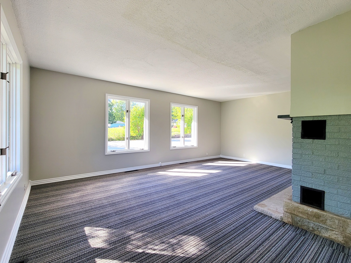 28W450 Roosevelt Road Winfield, IL 60190 - Photo 3 of 28 a view of an empty room with wooden floor and a window