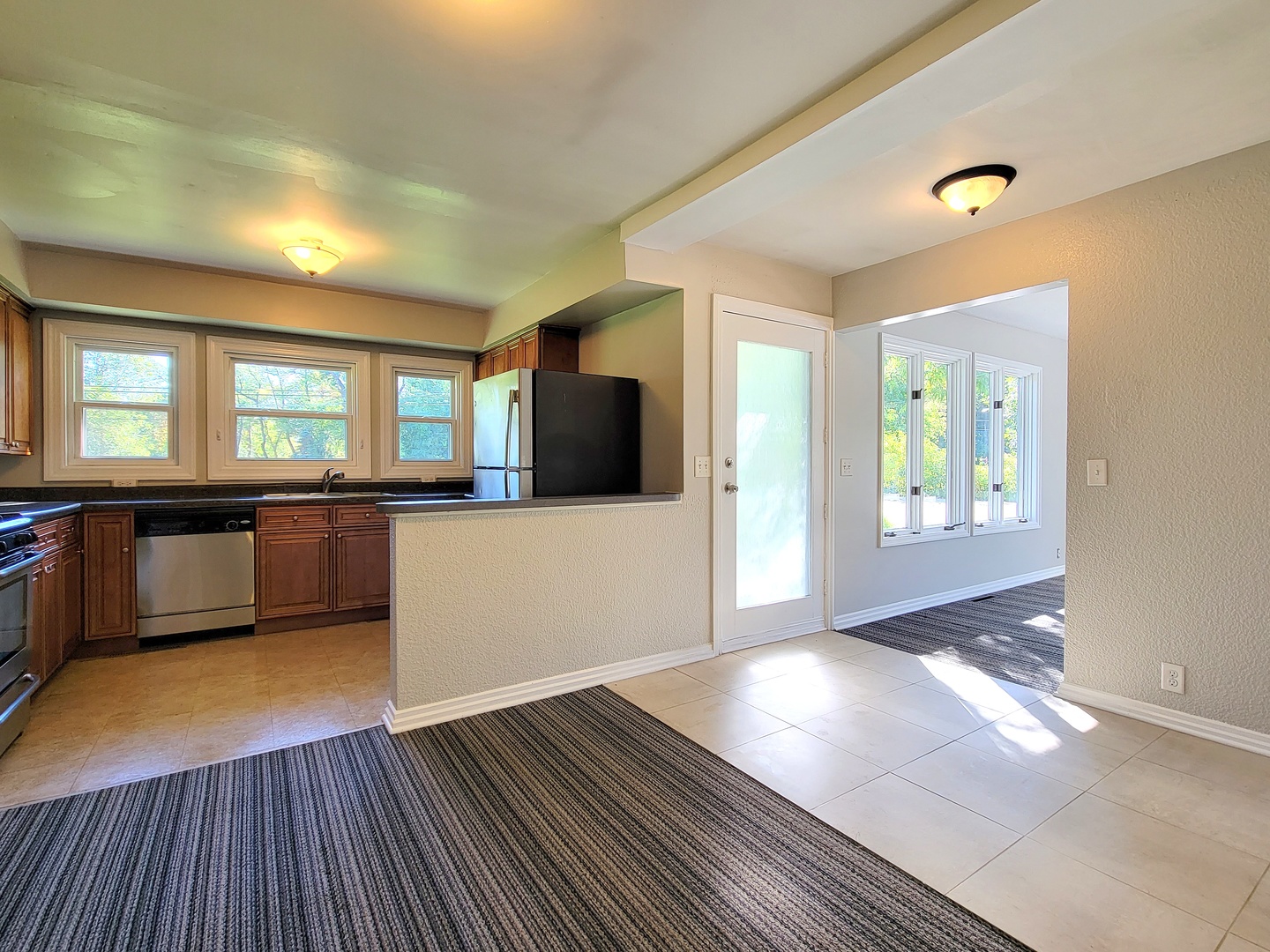 28W450 Roosevelt Road Winfield, IL 60190 - Photo 6 of 28 a view of a kitchen with wooden floor and a sink