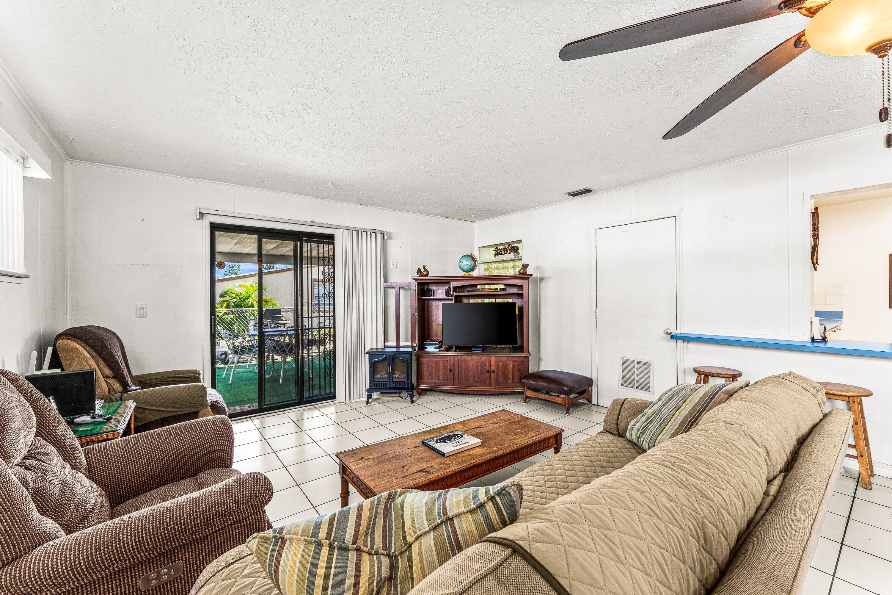 1040 West 1st Street Riviera Beach, FL 33404 - Photo 13 of 26 a living room with furniture and a large window