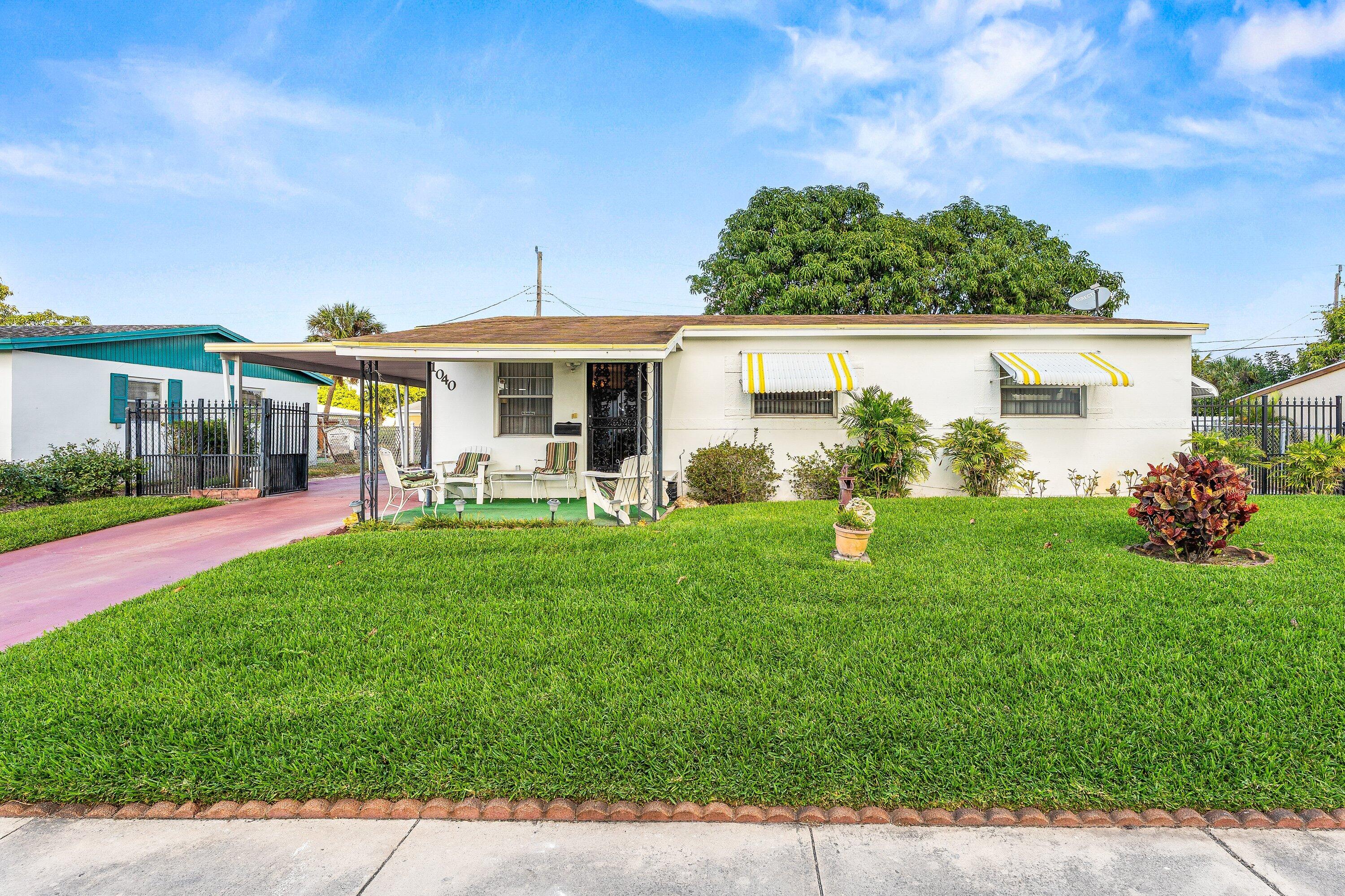 1040 West 1st Street Riviera Beach, FL 33404 - Photo 2 of 26 a view of outdoor space yard and patio