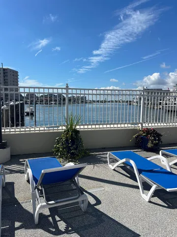 a view of a balcony with two chairs and a table