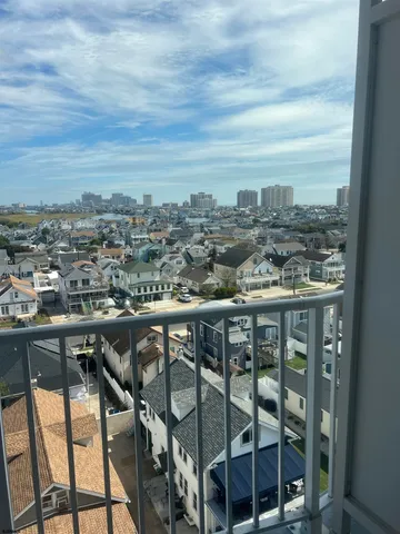 a view of a balcony with an outdoor seating