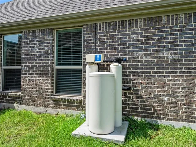a front view of house with yard and garage
