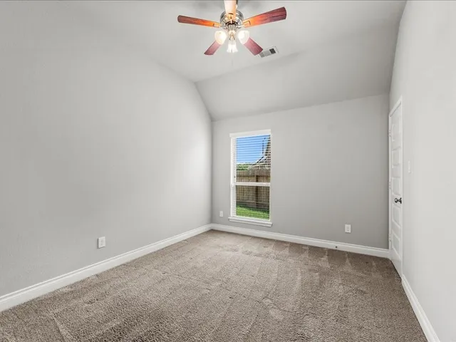 a bathroom with a granite countertop sink a toilet and bathtub