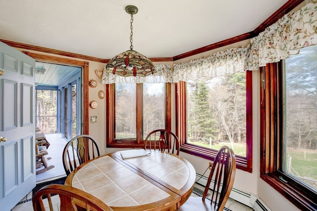 205 East Rindge Road Ashburnham, MA 01430 - Photo 18 of 40 a view of a dining room with furniture window and wooden floor