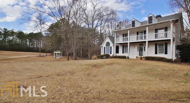 144 Brooks Road Brooks, GA 30205 - Photo 1 of 1 a view of a house with snow on the road