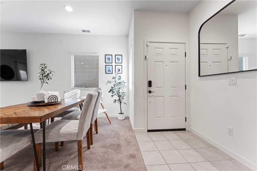 12704 Ironstone Way Moreno Valley, CA 92555 - Photo 18 of 38 a view of a dining room with furniture