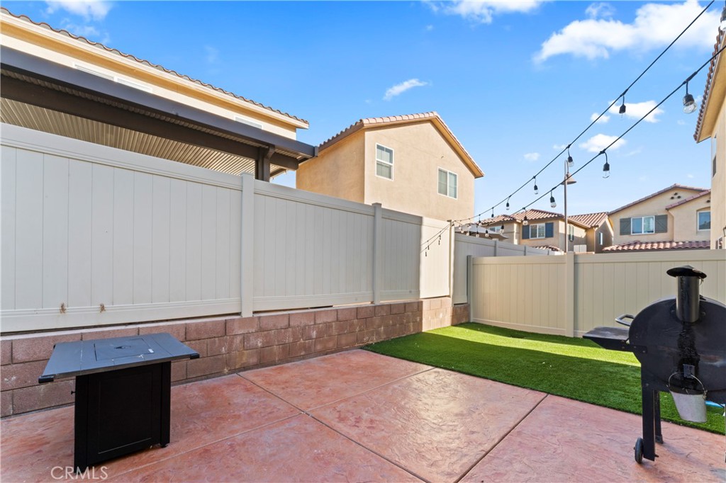 12704 Ironstone Way Moreno Valley, CA 92555 - Photo 28 of 38 a view of a backyard with hardwood