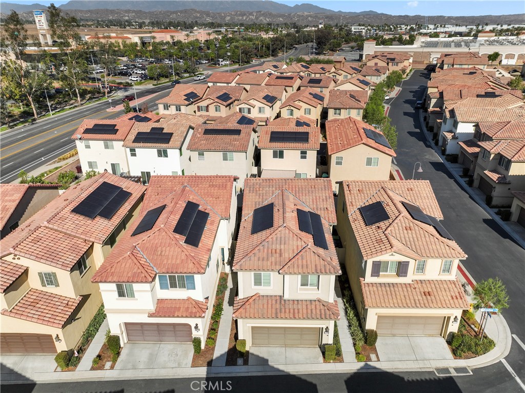 12704 Ironstone Way Moreno Valley, CA 92555 - Photo 3 of 38 an aerial view of a residential apartment building with a city view