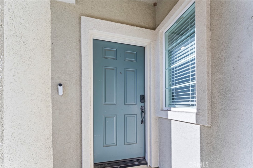 12704 Ironstone Way Moreno Valley, CA 92555 - Photo 32 of 38 a view of front door with a bathroom