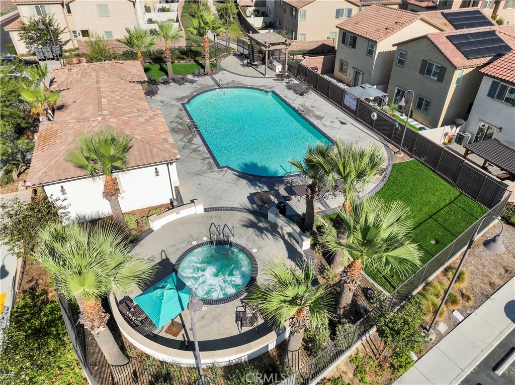 12704 Ironstone Way Moreno Valley, CA 92555 - Photo 35 of 38 an aerial view of a house with swimming pool garden and patio
