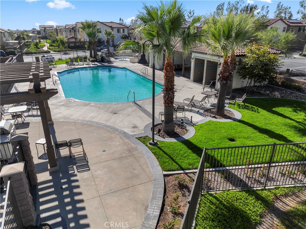 12704 Ironstone Way Moreno Valley, CA 92555 - Photo 36 of 38 an aerial view of a house with a garden and swimming pool