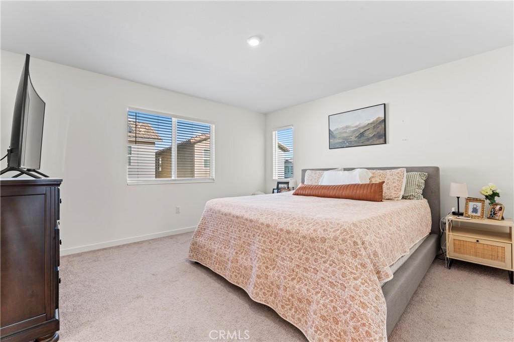 12704 Ironstone Way Moreno Valley, CA 92555 - Photo 5 of 38 a bedroom with bed and a window