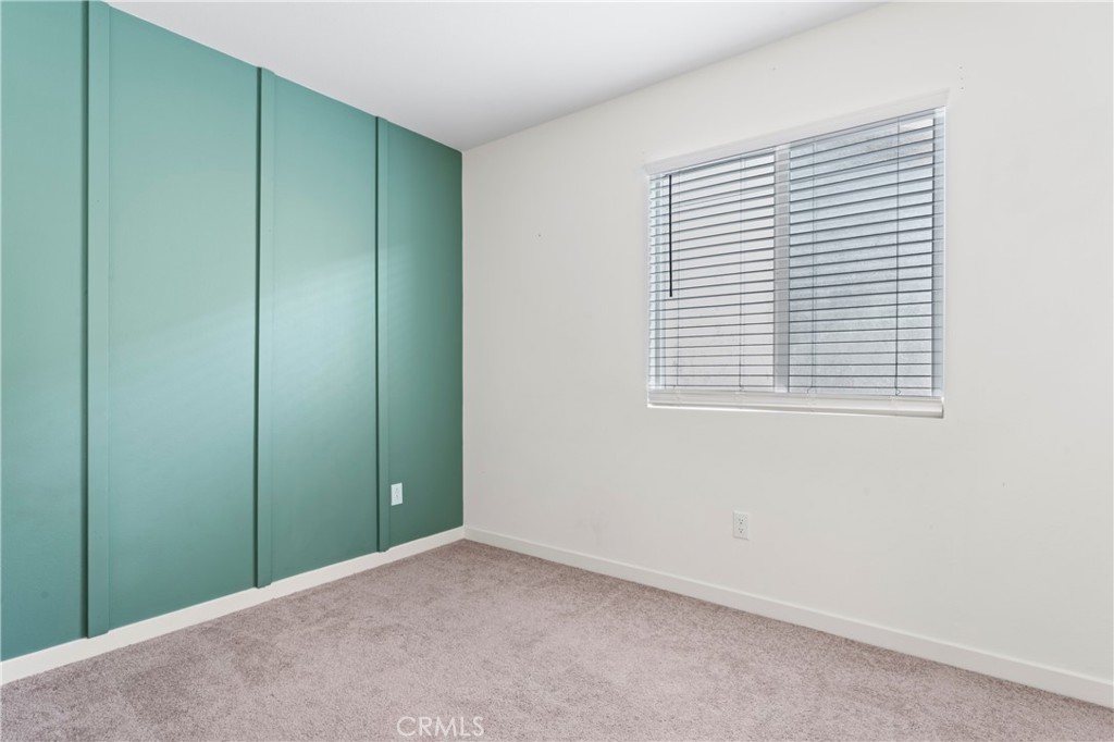 12704 Ironstone Way Moreno Valley, CA 92555 - Photo 7 of 38 a view of an empty room with a window